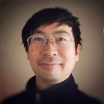 Headshot of Aaron Rau, Co-Founder and CTO of Health Note, smiling in a professional setting.