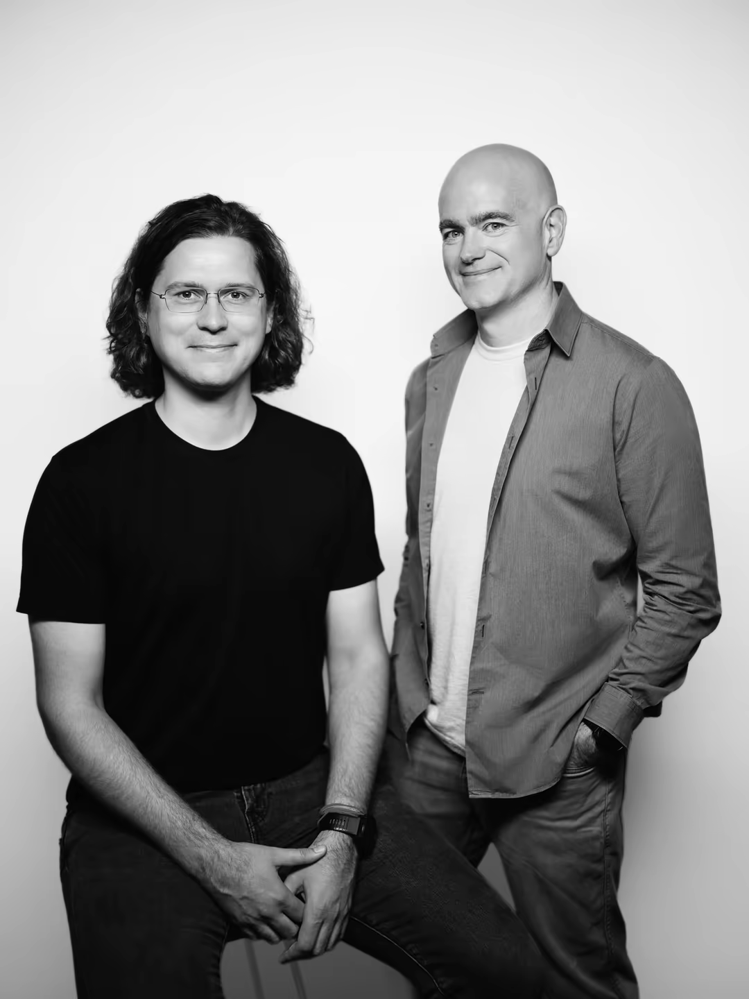 YSecurity co-founders Sasha Sinkevich and Jon McLachlan, hosts of The Security Podcast of Silicon Valley, in a black and white studio portrait