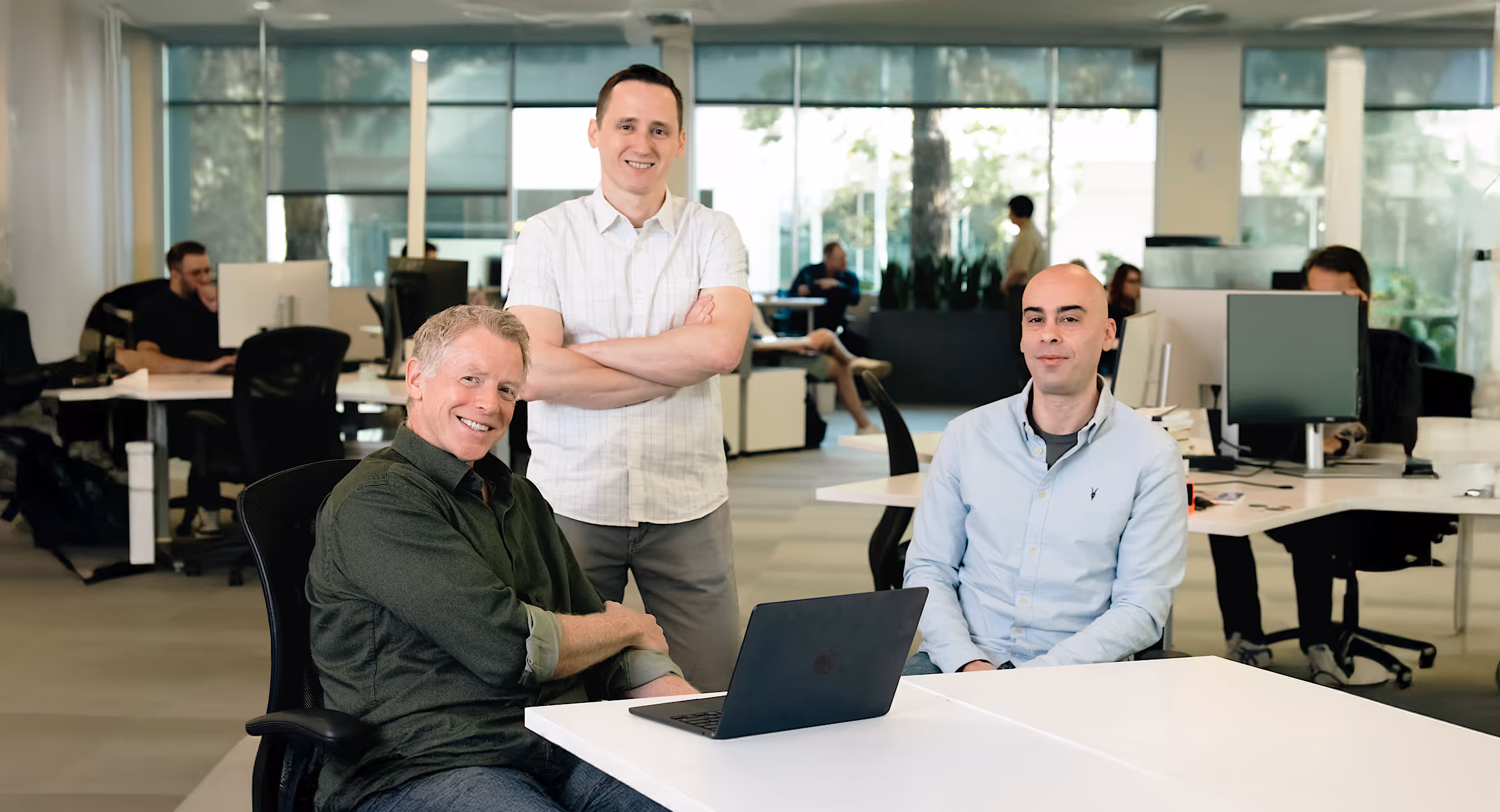 The Augment Code team together at their office.