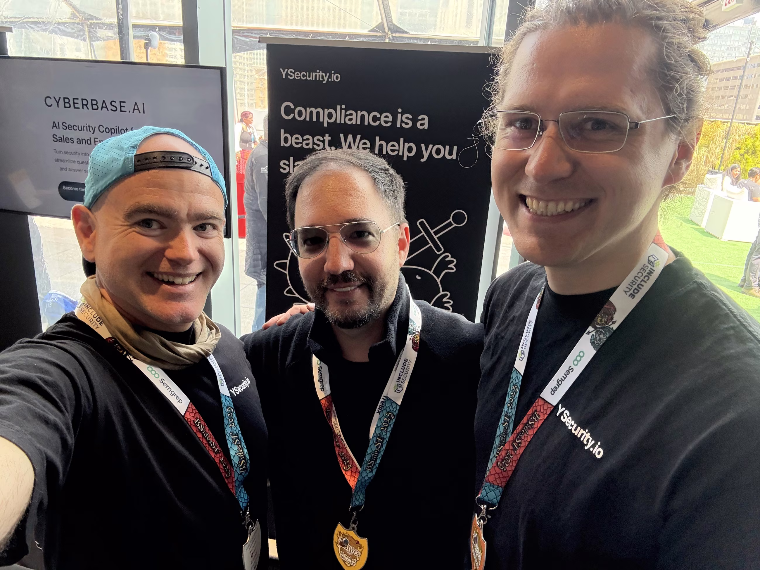 Three of the team wearing BSidesSF badge medals