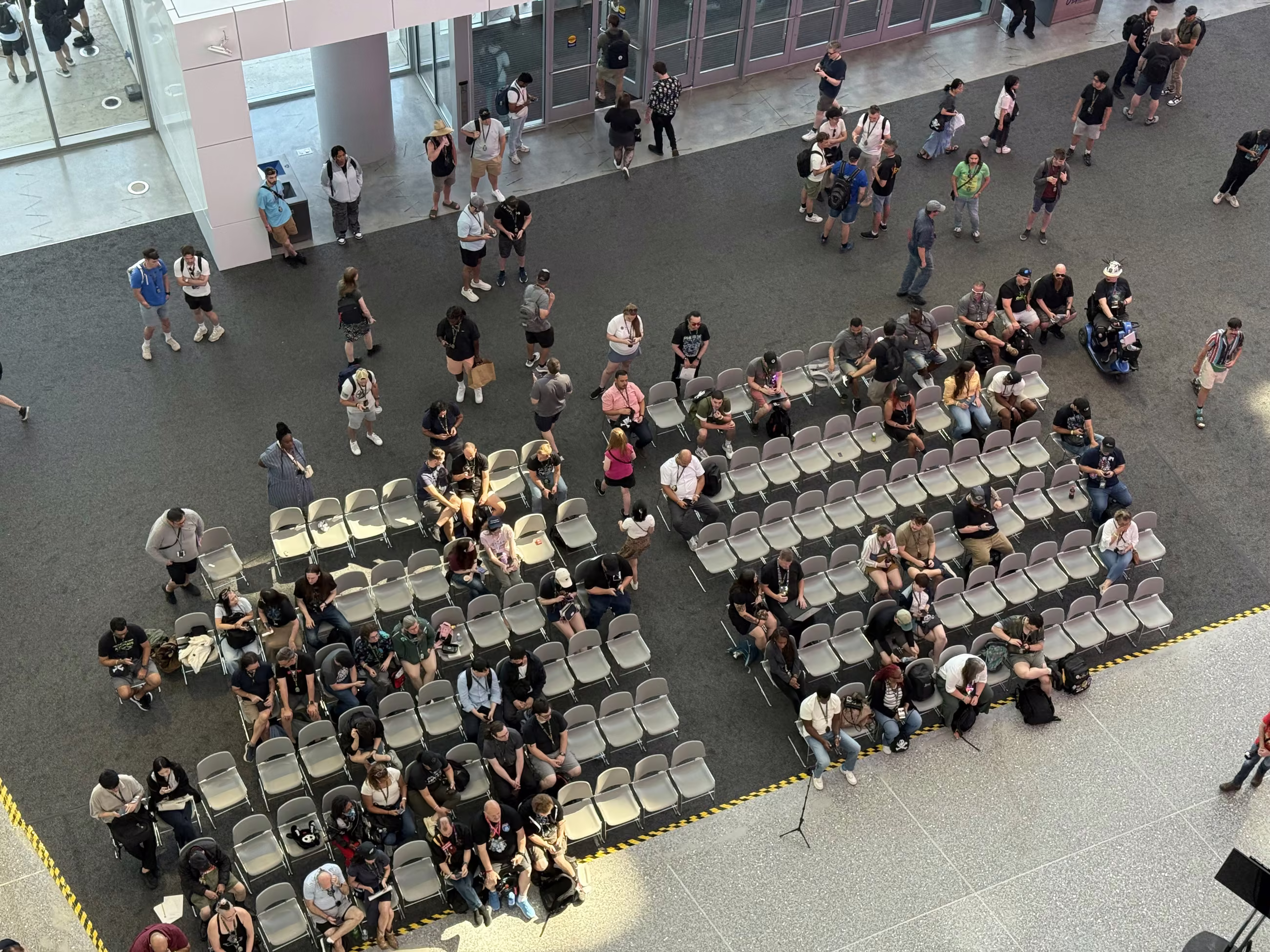 Overhead view of a packed session floor at DEF CON 33