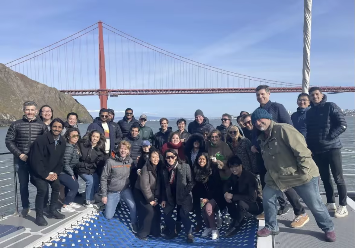 The Robust Intelligence team on a boat on San Francisco Bay, with the Golden Gate Bridge behind them.